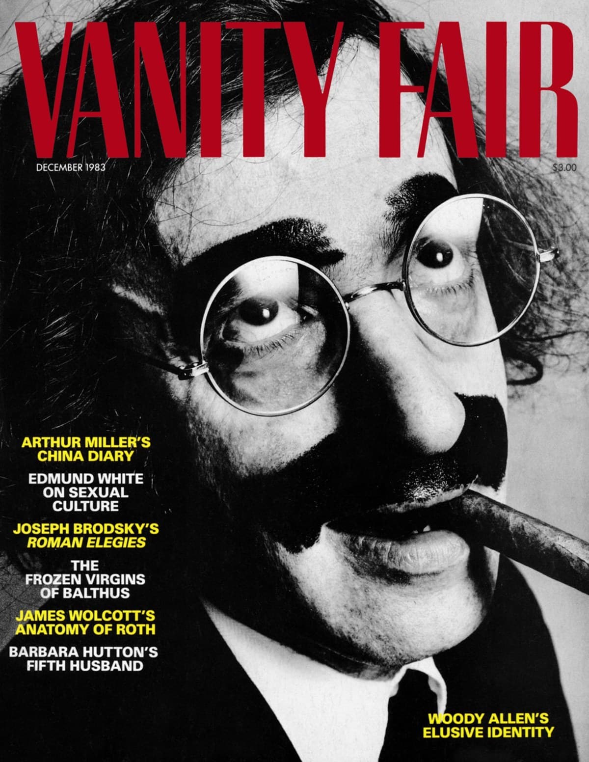 Portada de Vanity Fair con cabecera roja y un rostro en blanco y negro con gafas, bigote y nariz de disfraz.